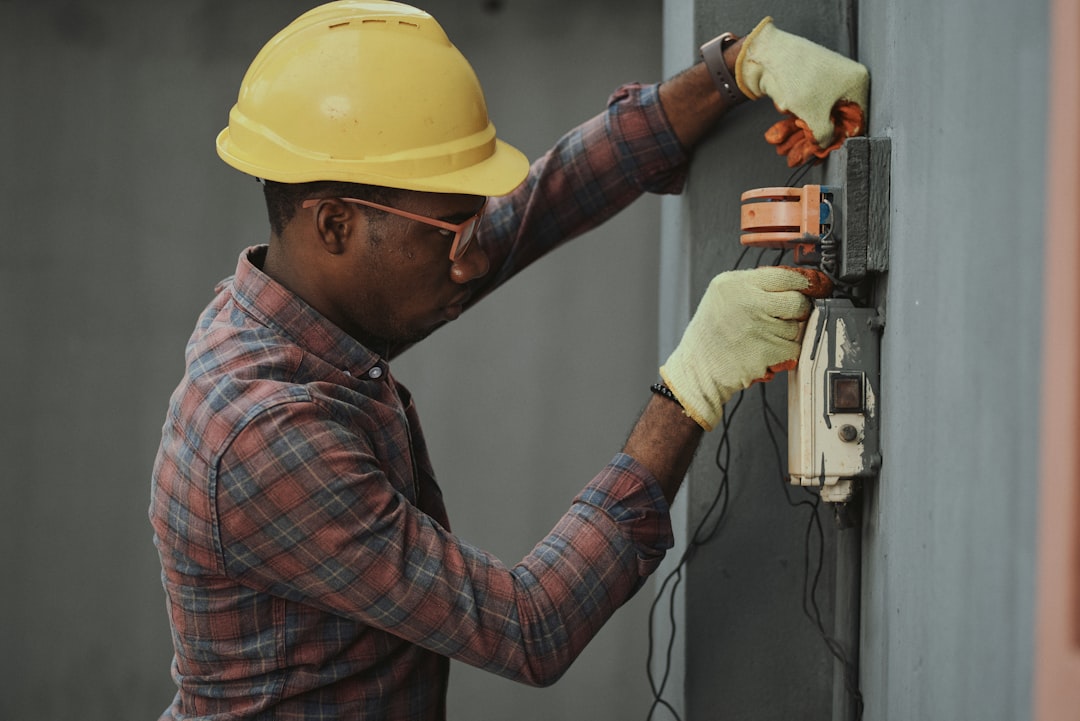 Skilled electrician with organized tools and equipment demonstrating professional readiness for service work